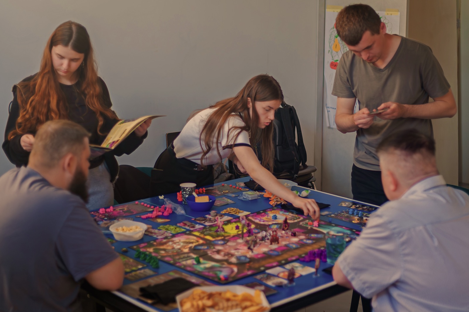 A group playing a board game at a table